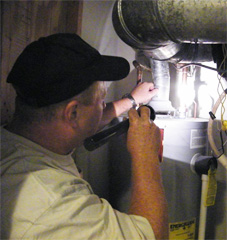 Stu inspecting a water heater